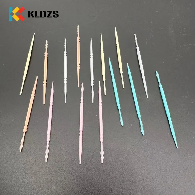 Palillo de dientes de plástico en forma de espina de pescado